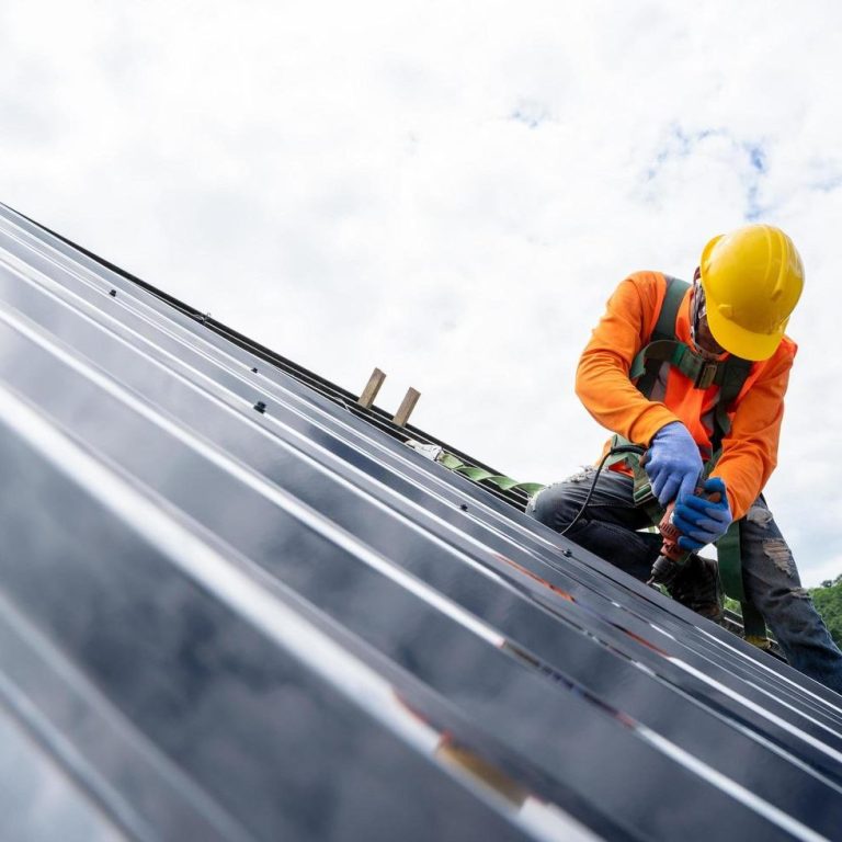 roofer working on roof - for emergency roofing services in cheltenham